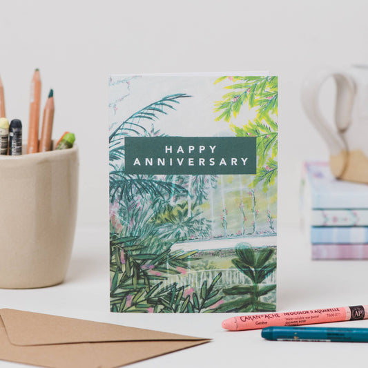Luxury A6 happy anniversary greetings card with tropical palm house illustration, blank inside, printed on 350gsm UK card with recycled Kraft envelope