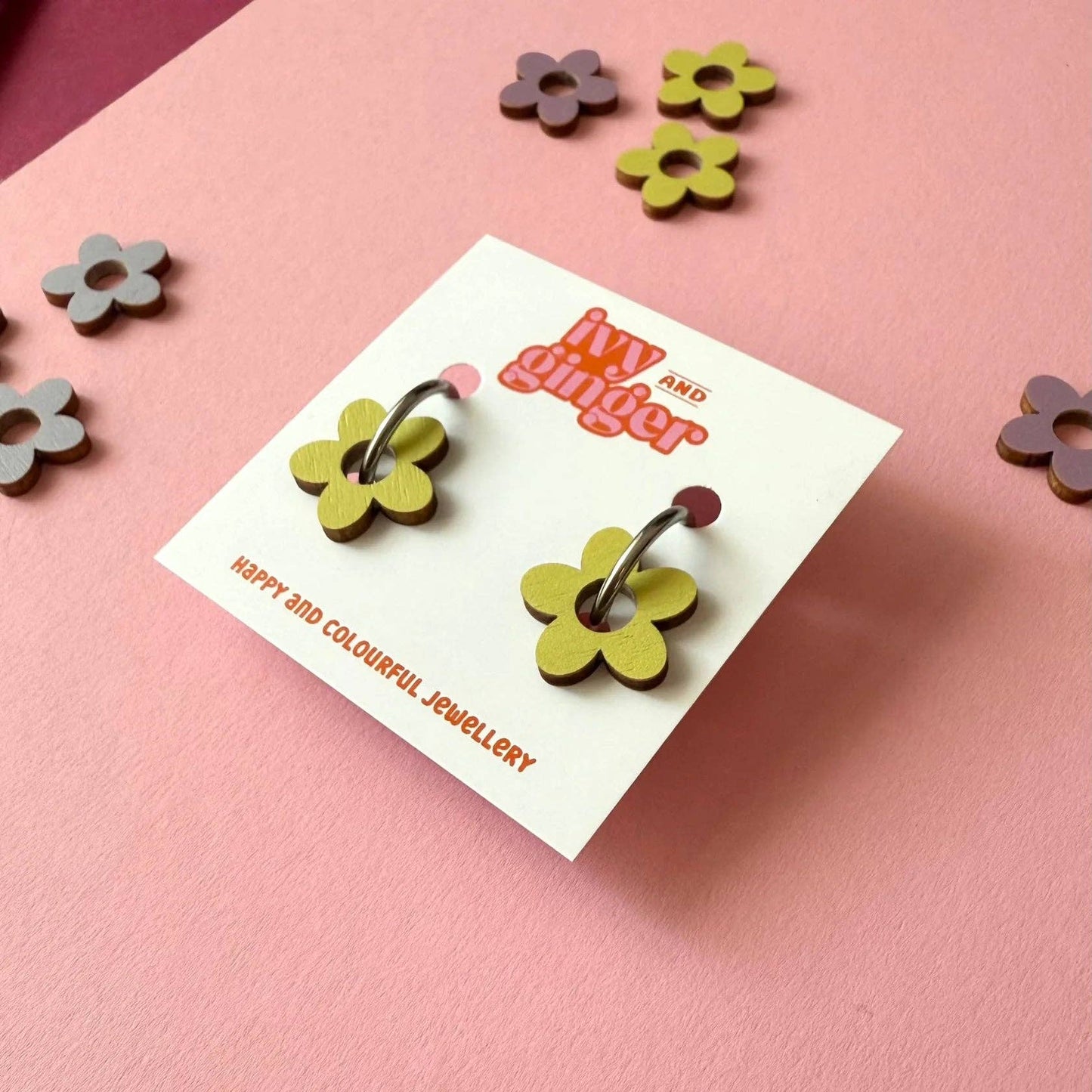 A pair of Ivy and Ginger pistachio flower shaped hoop earring