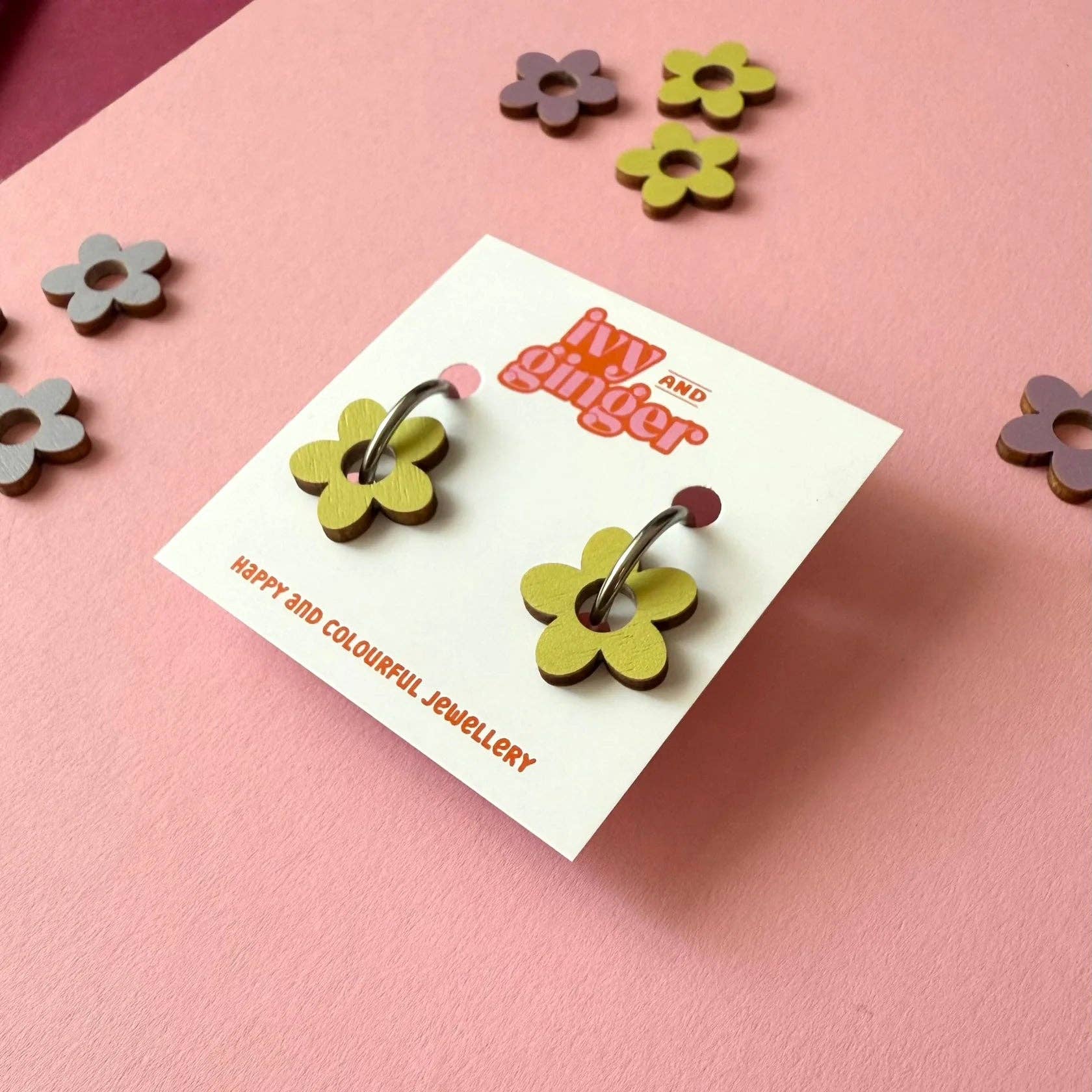 A pair of Ivy and Ginger pistachio flower shaped hoop earring