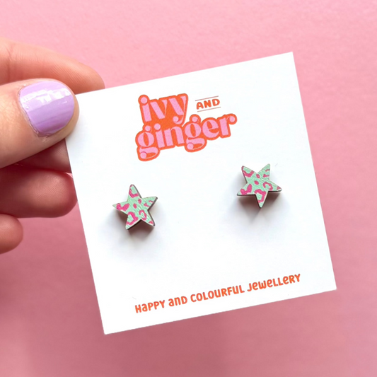 Mint green and pink leopard print star-shaped stud earrings made from FSC wood with surgical steel posts.
