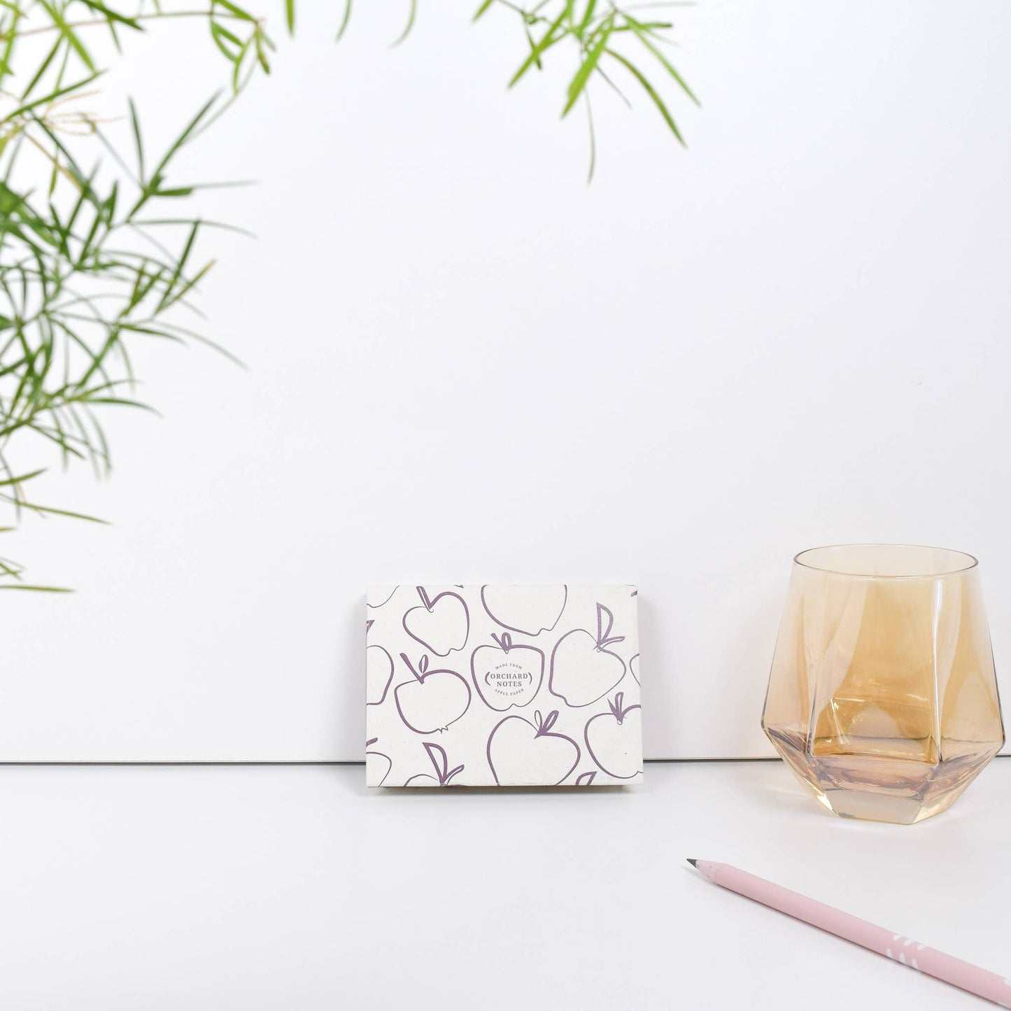 Recycled sticky notes pad in pink with Orchard Notes debossed cover and three sizes of biodegradable sticky notes