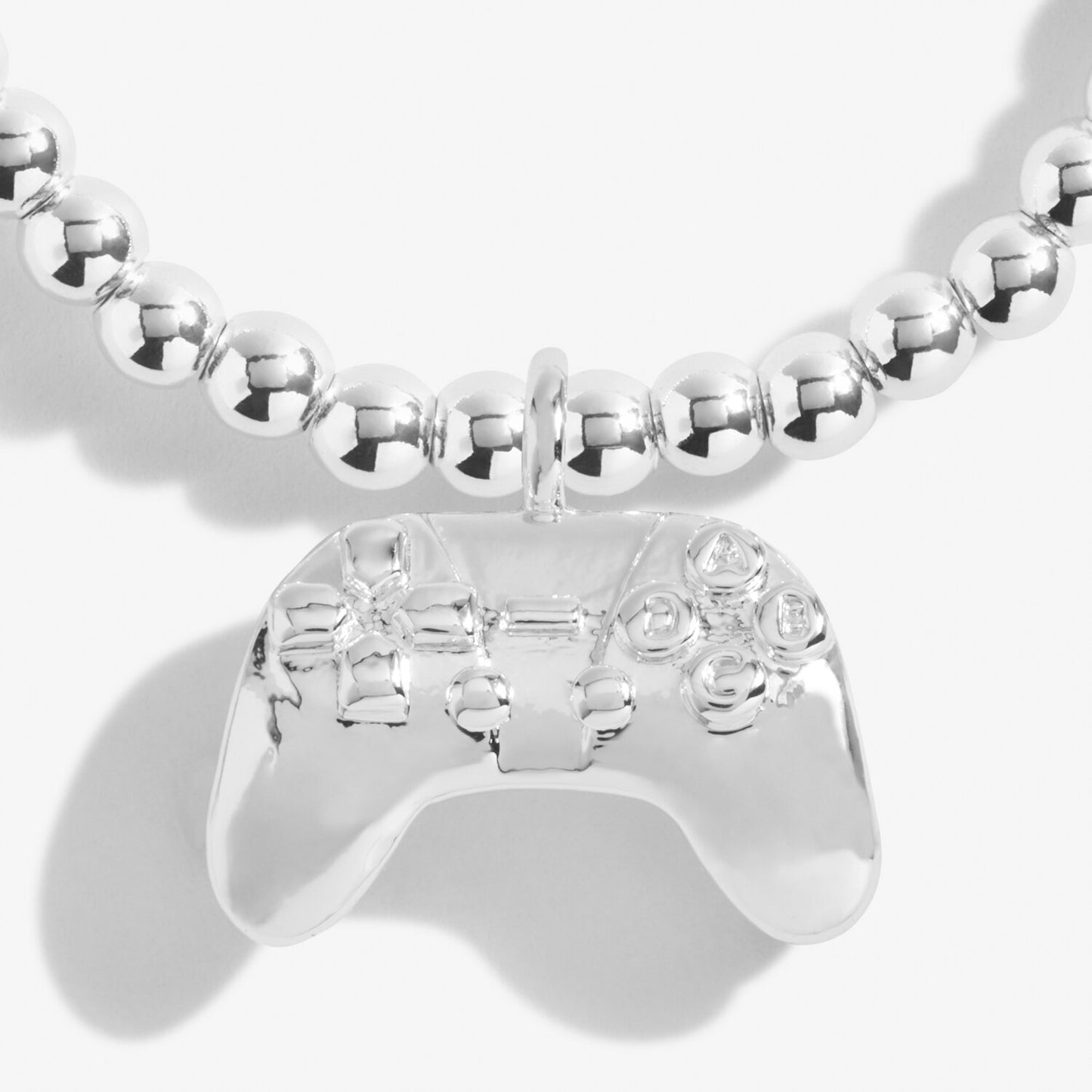 'Girl Gamer’ bracelet with gaming controller shaped charm. Silver-plated, stretch fit, and gift boxed