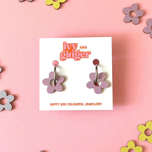 A pair of Ivy and Ginger dusky lilac flower-shaped hoop earrings
