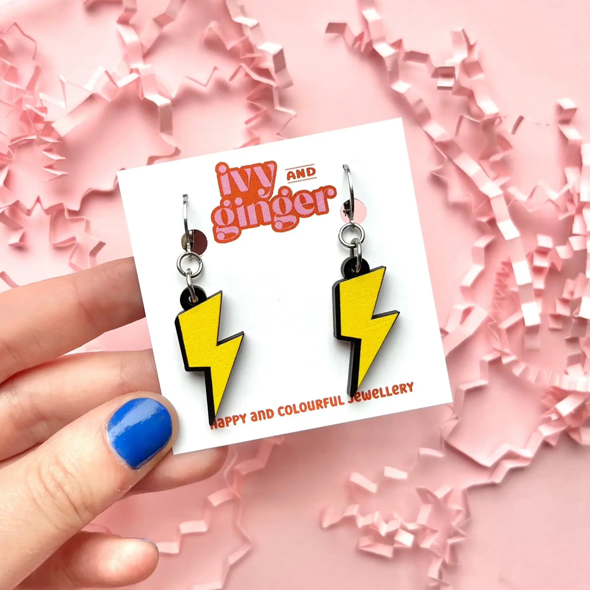 Bright lightning bolt dangle earrings, FSC wood, digital print, lightweight 45mm drop, surgical steel huggie hoops for sensitive ears.