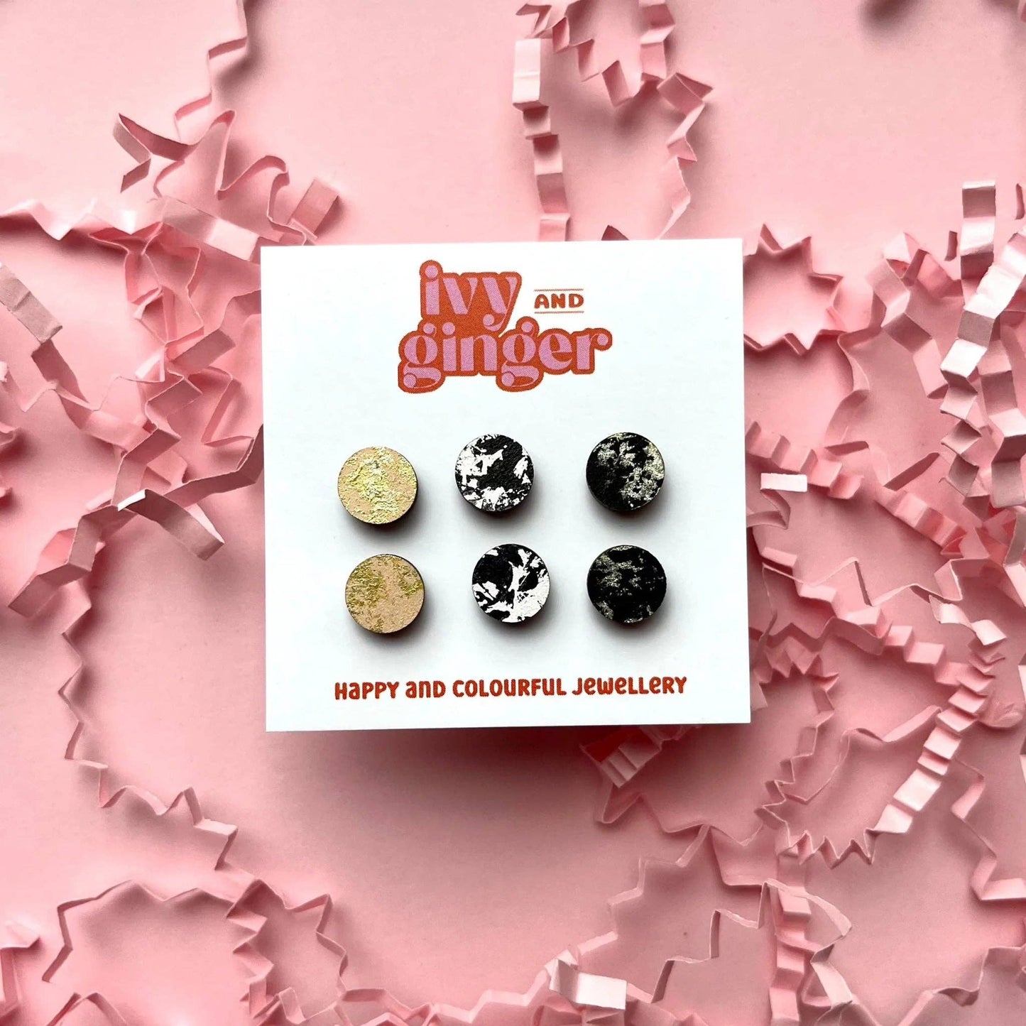 Black, cream, and gold hand-painted wooden stud earrings, 10mm FSC certified, with surgical steel backs for sensitive ears.