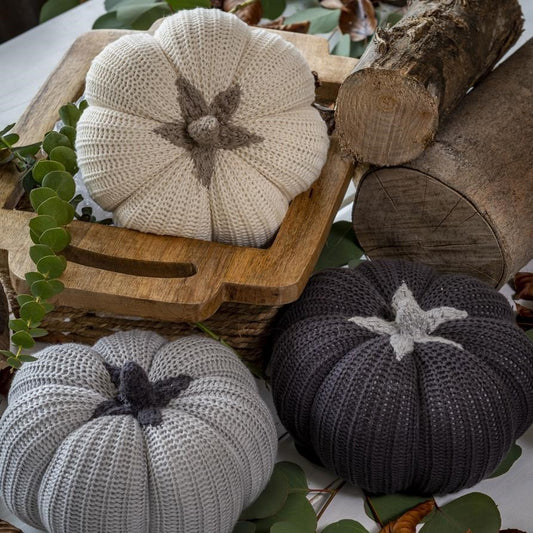 Knitted cotton pumpkin with contrasting stalks in grey or cream.