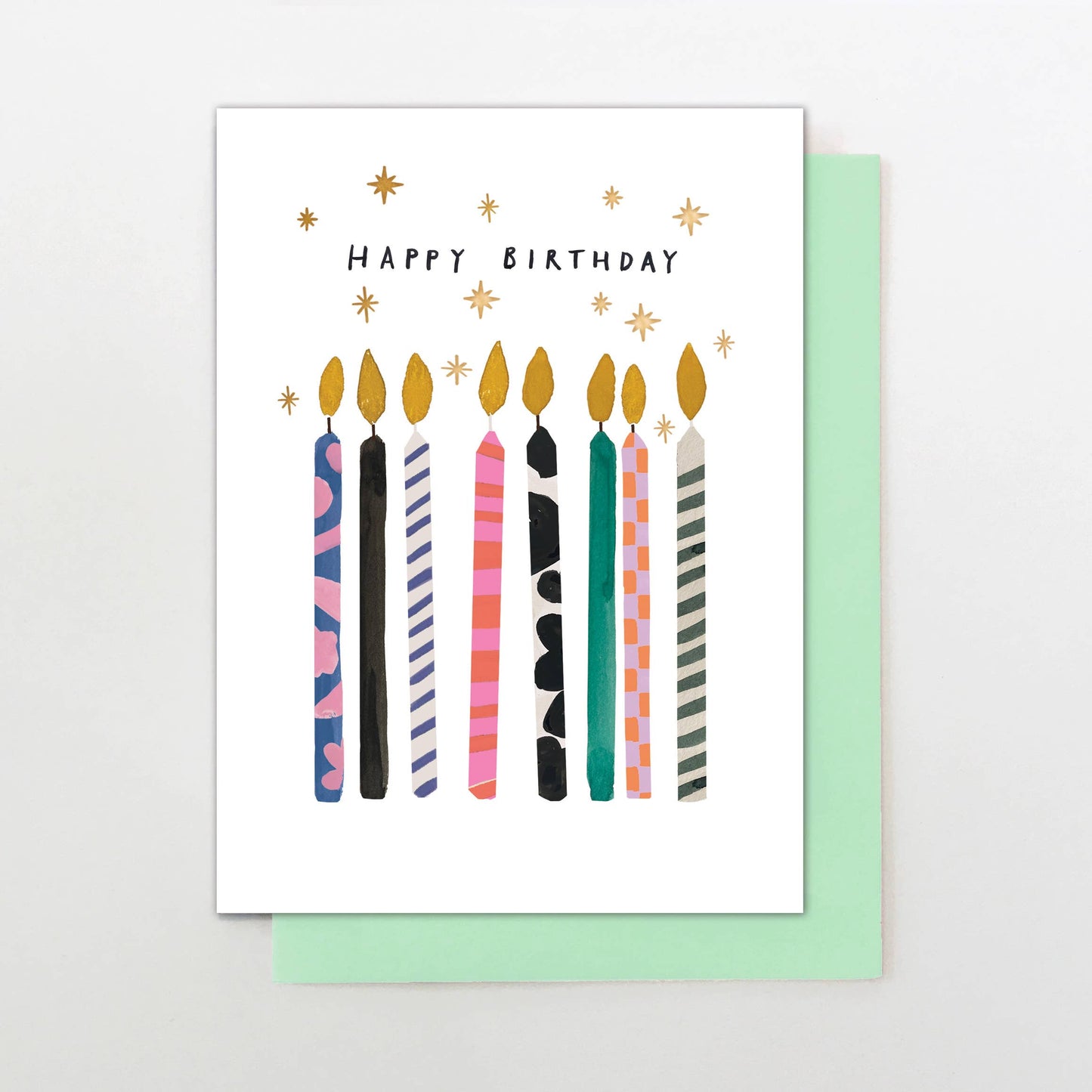 Luxury Happy Birthday card with candles and raised gold foil, paired with jade green envelope and sustainably sourced card.