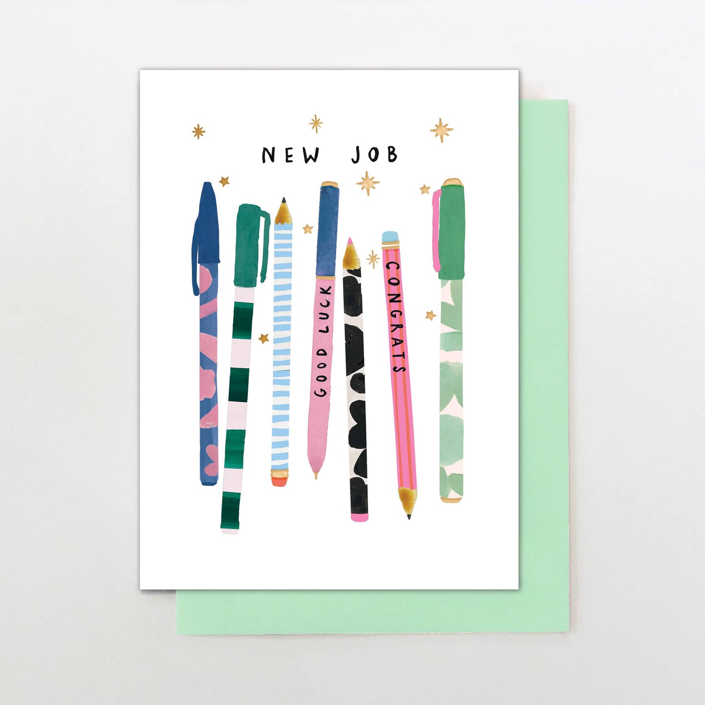 New job card with pen illustrations, green envelope, gold foil, “Good Luck” and “Congrats” pens