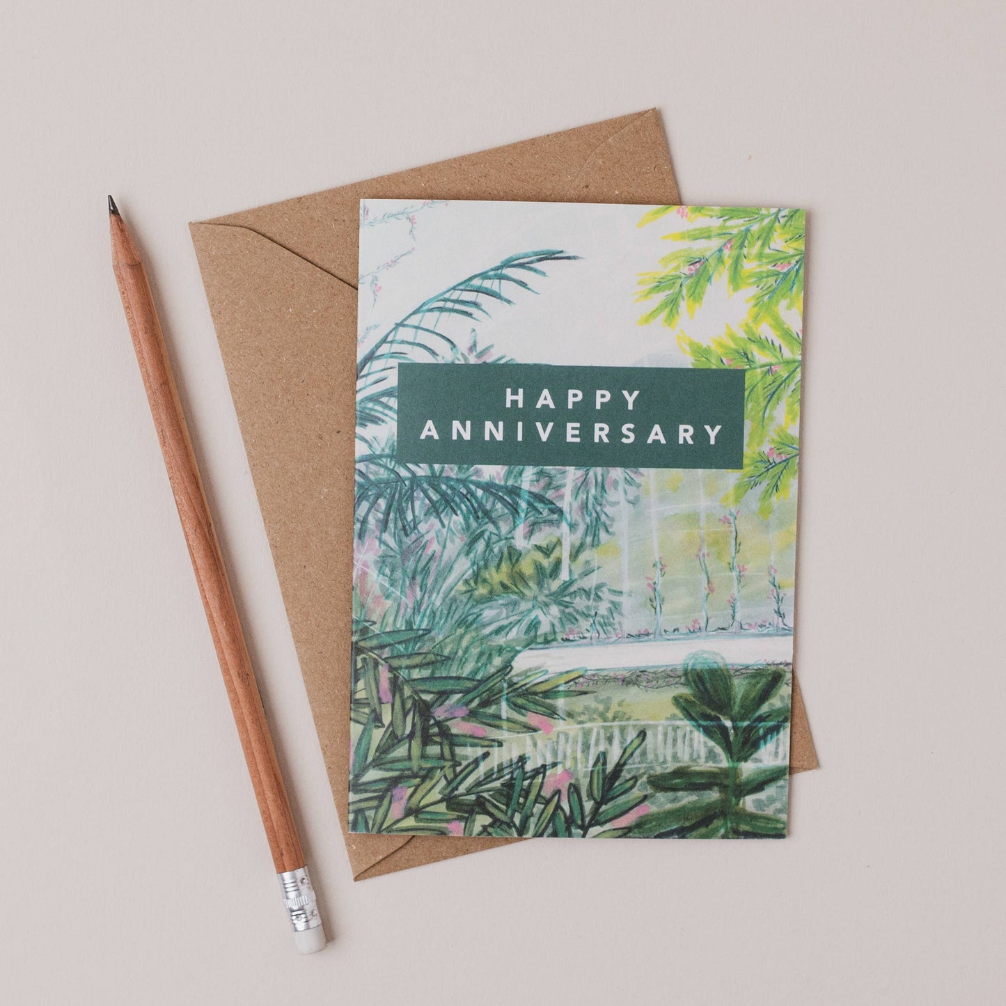 Luxury A6 happy anniversary greetings card with tropical palm house illustration, blank inside, printed on 350gsm UK card with recycled Kraft envelope