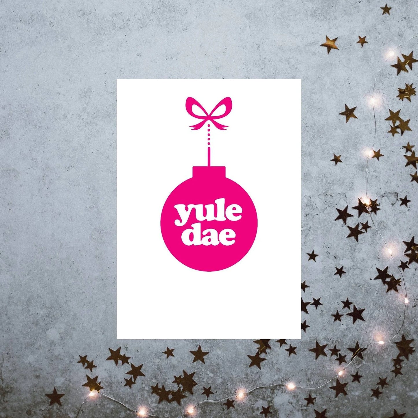 A vertically folded greeting card with the Scottish Christmas phrase "Yule Dae" in a hand-designed typography style.