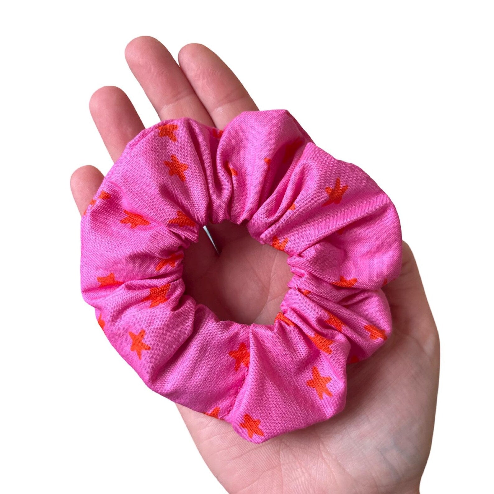 Handmade large cotton scrunchie in colourful star pattern fabric, soft and reusable accessory