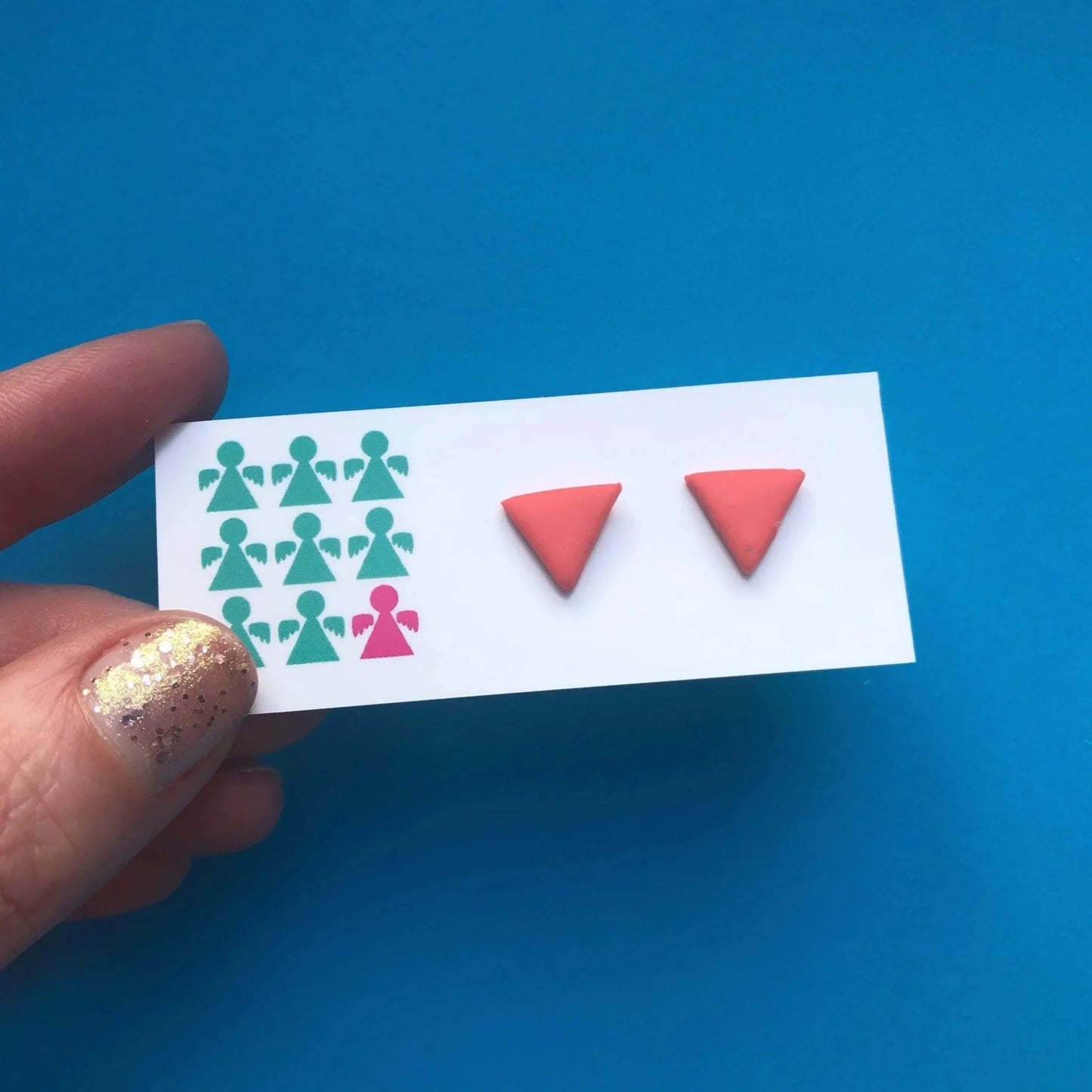 CORAL PINK TRIANGLE STUDS