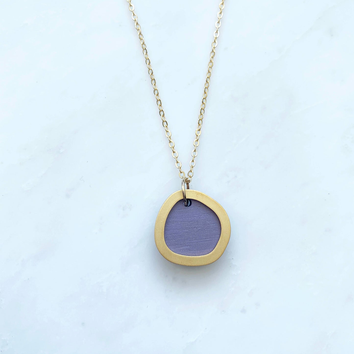 Gold-plated necklace with 1.5cm circular pendant in assorted colours on 22" chain