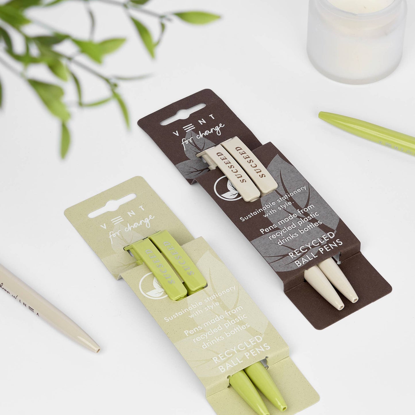 2 sets of recycled pens in brown SUCSEED Coffee sleeve and light green SUCSEED Kiwi sleeve made from single-use plastic bottles