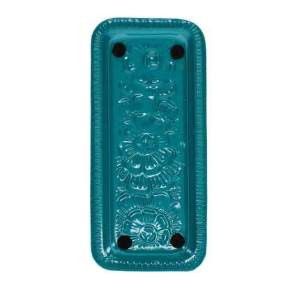 Rectangular teal blue enamel cast metal tray with floral centre and line border, foam pads on base