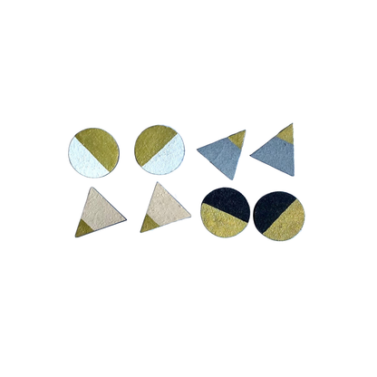 Set of four monochrome and gold stud earrings in triangle and circle shapes, handmade from FSC wood with surgical steel posts.