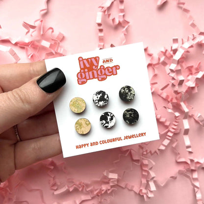 Black, cream, and gold hand-painted wooden stud earrings, 10mm FSC certified, with surgical steel backs for sensitive ears.