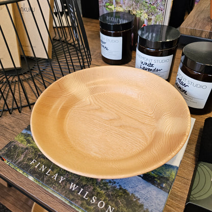 Beautifully handcrafted wooden plate with unique grain and character
