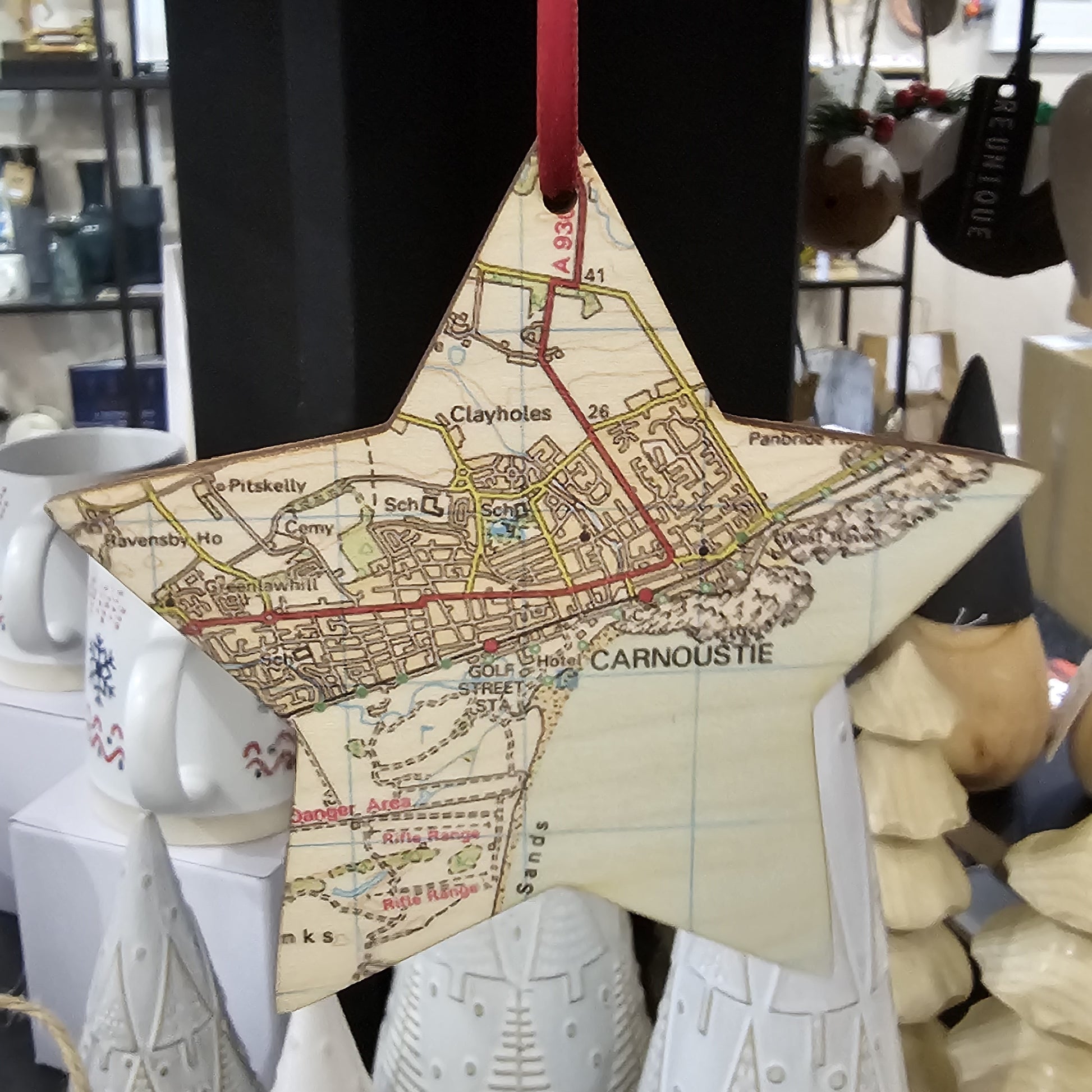 Wooden star shaped tree decoration cut from 3mm birch plywood featuring a Carnoustie map print 