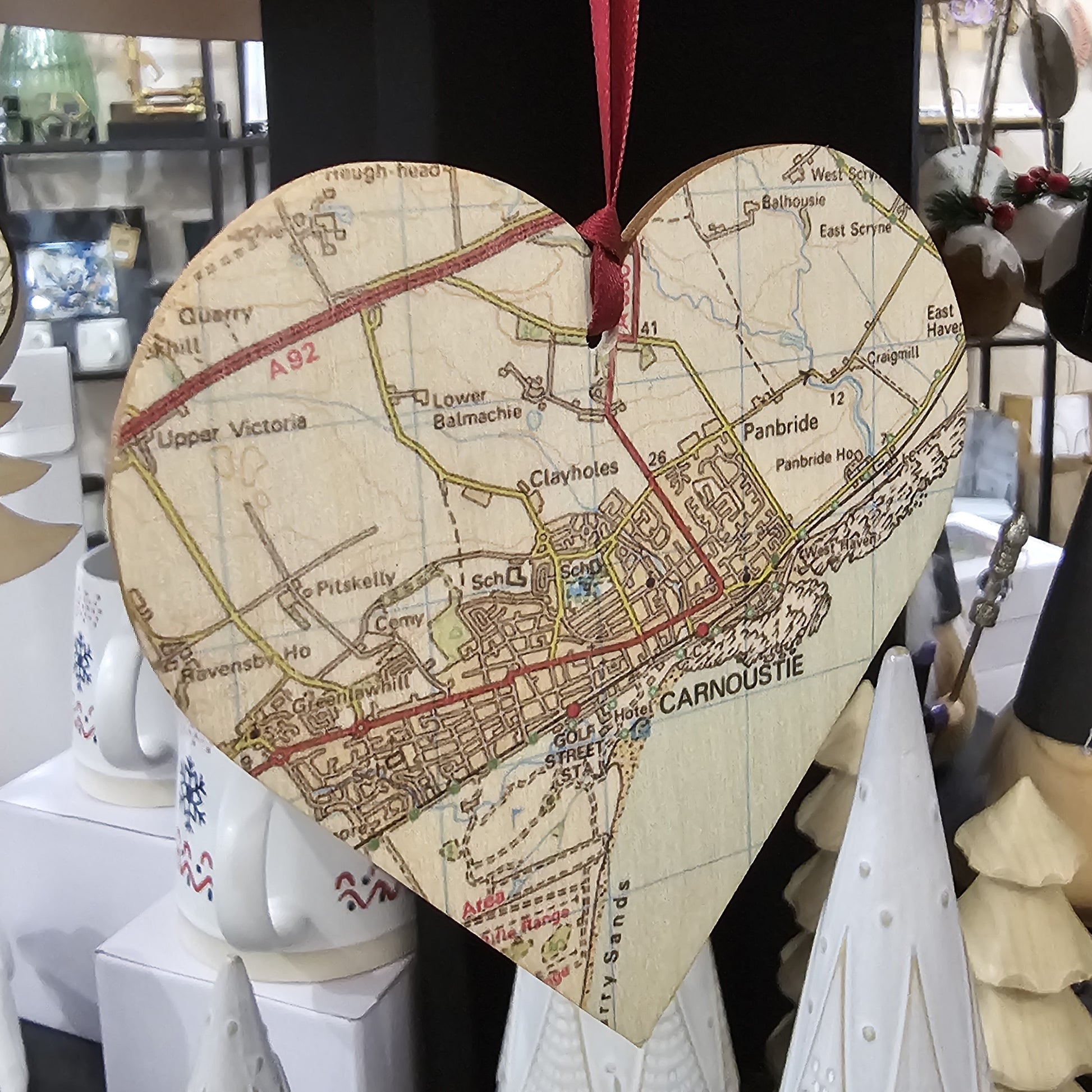 Wooden heart shaped tree decoration cut from 3mm birch plywood featuring a Carnoustie map print 