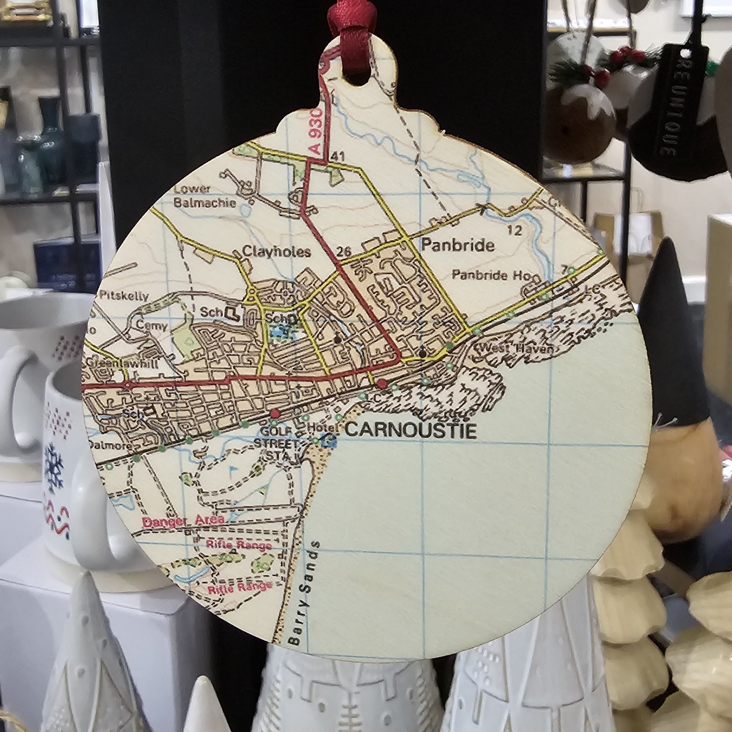 Wooden bauble shaped tree decoration cut from 3mm birch plywood featuring a Carnoustie map print 
