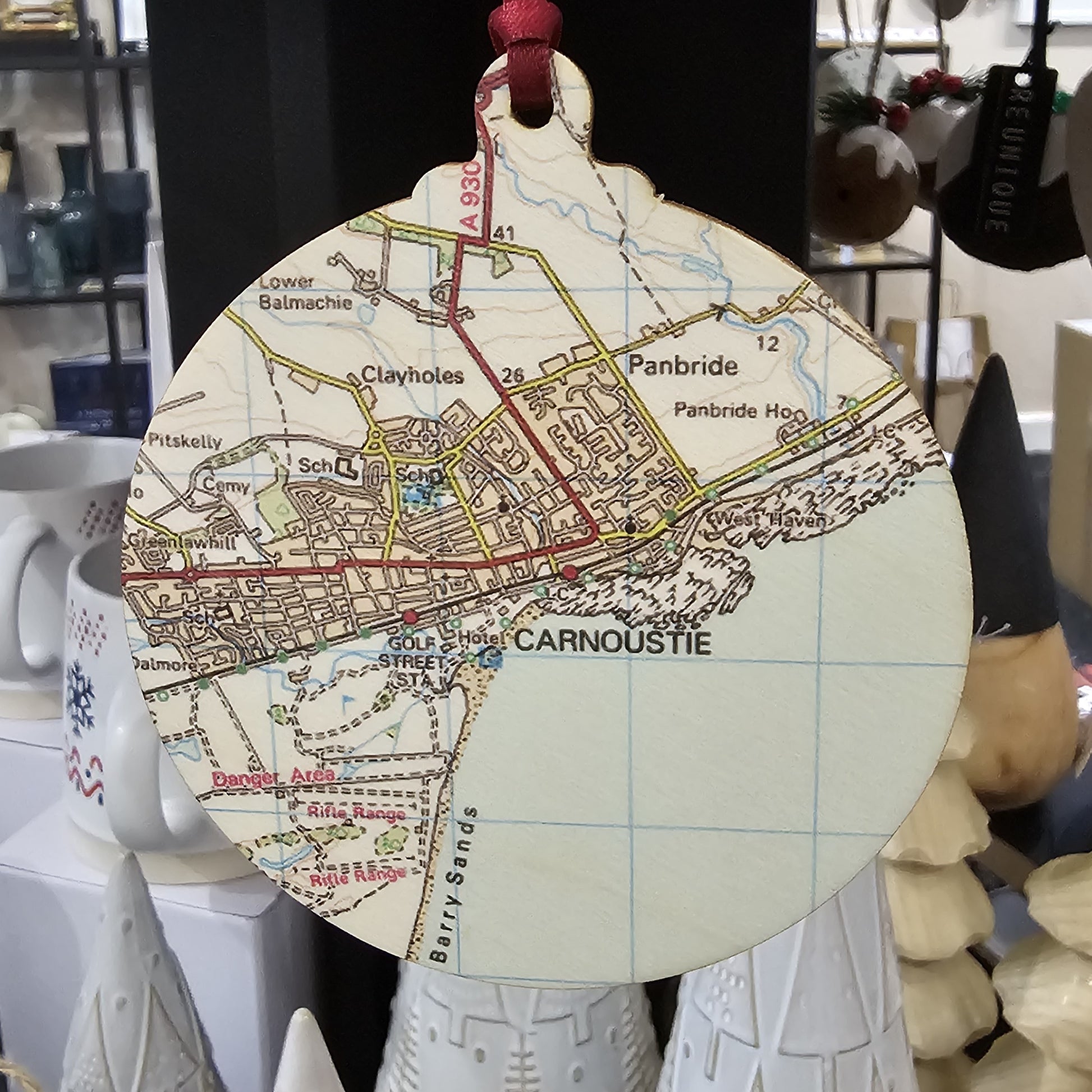 Wooden bauble shaped tree decoration cut from 3mm birch plywood featuring a Carnoustie map print 