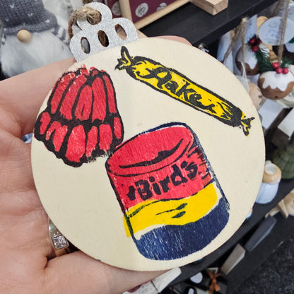 Small handprinted wooden Christmas tree decorations featuring trifle design