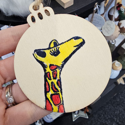 Small handprinted wooden Christmas tree decorations featuring Gertie design