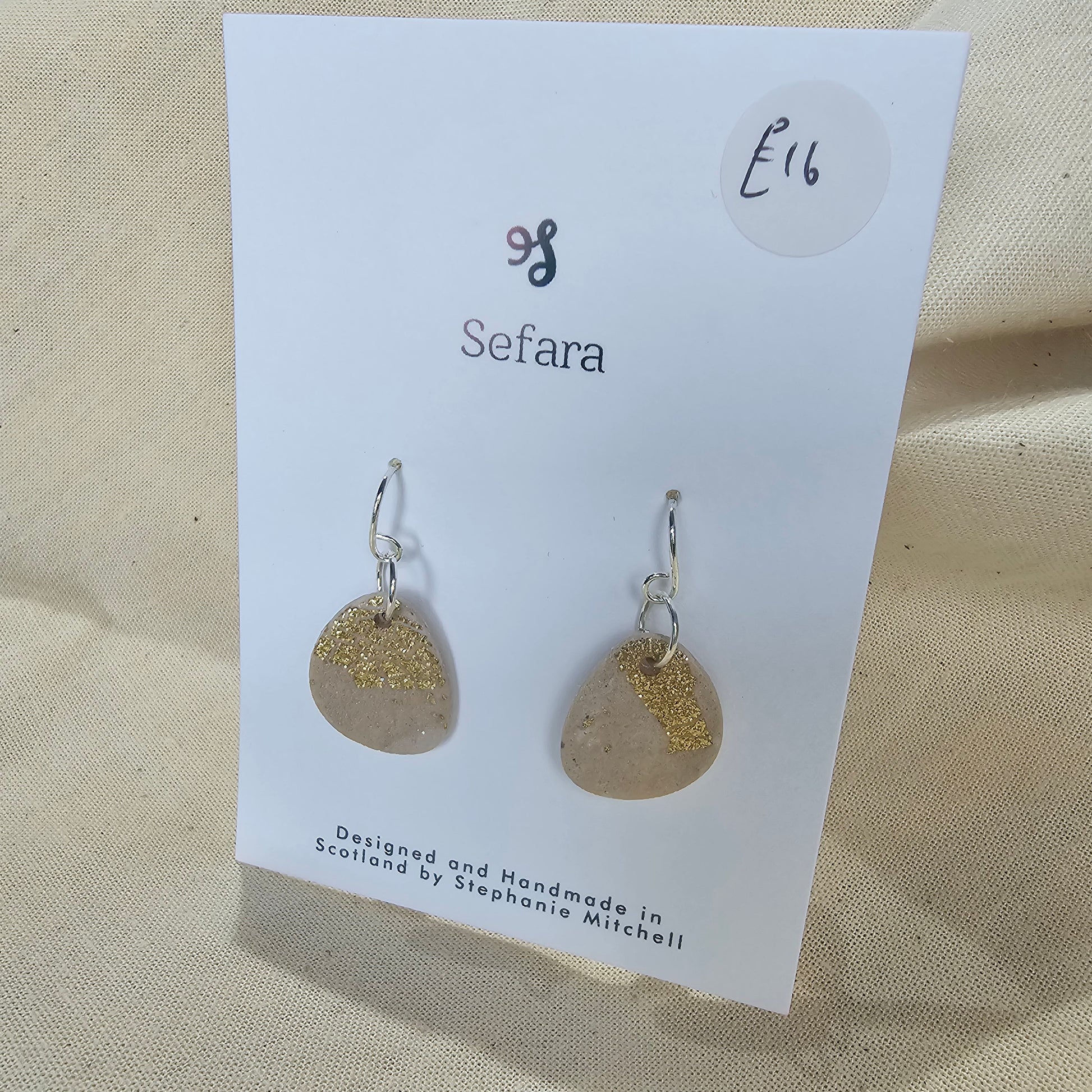 Pair of handmade polymer clay hook earrings – lightweight cream and gold leaf design by Sefara Jewellery