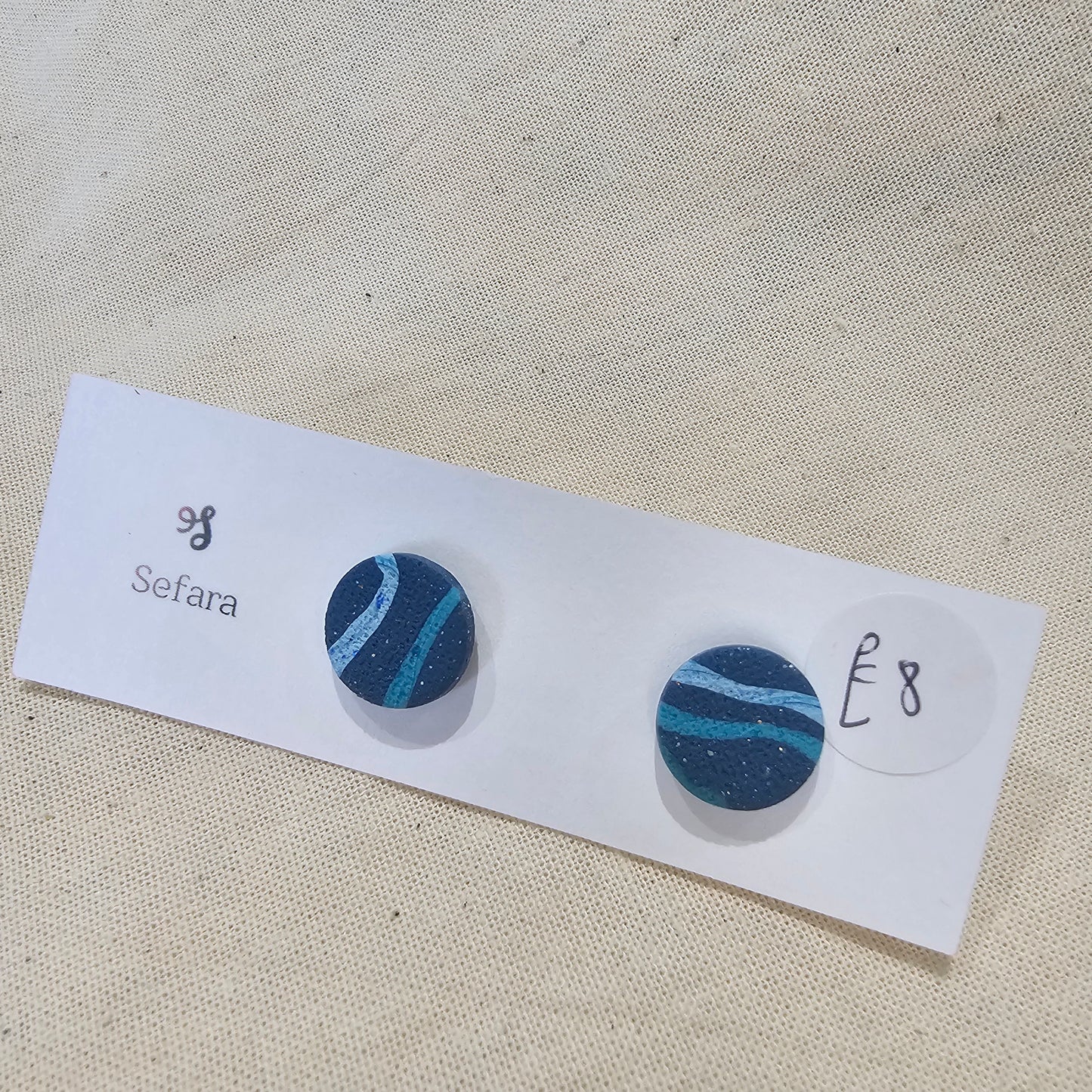 Handmade polymer stud earrings – lightweight blue striped design by Sefara Jewellery