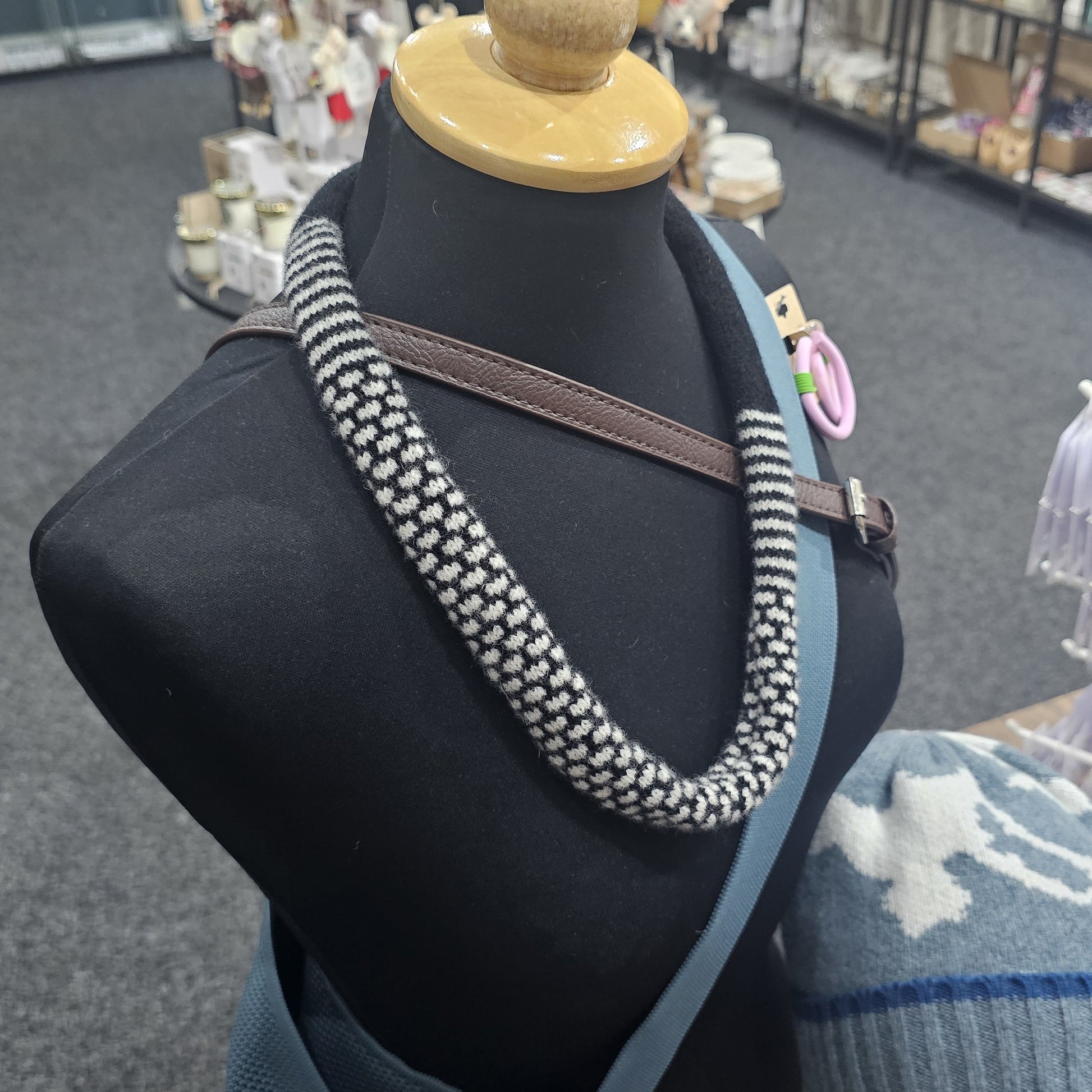 Handmade Scottish lambswool knitted necklace in soft looped design, shown on mannequin highlighting texture and craftsmanship.