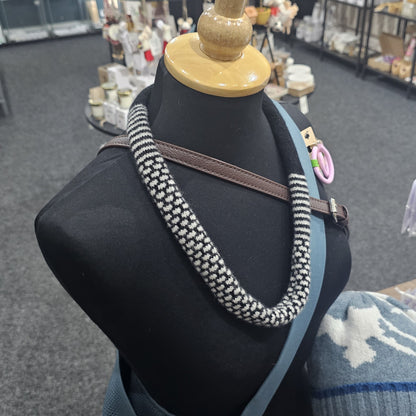 Handmade Scottish lambswool knitted necklace in soft looped design, shown on mannequin highlighting texture and craftsmanship.