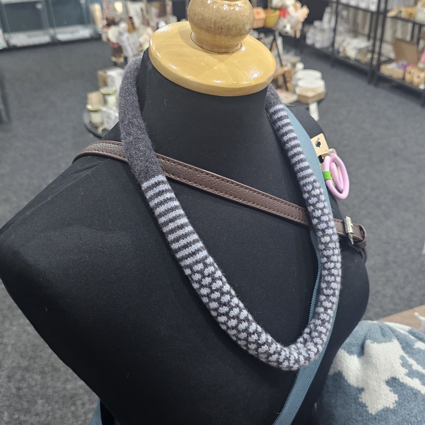 Handmade Scottish lambswool knitted necklace in soft looped design, shown on mannequin highlighting texture and craftsmanship.