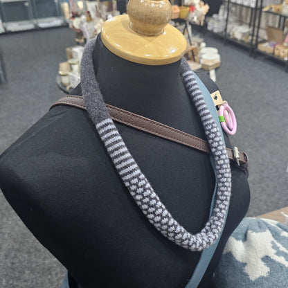 Handmade Scottish lambswool knitted necklace in soft looped design, shown on mannequin highlighting texture and craftsmanship.