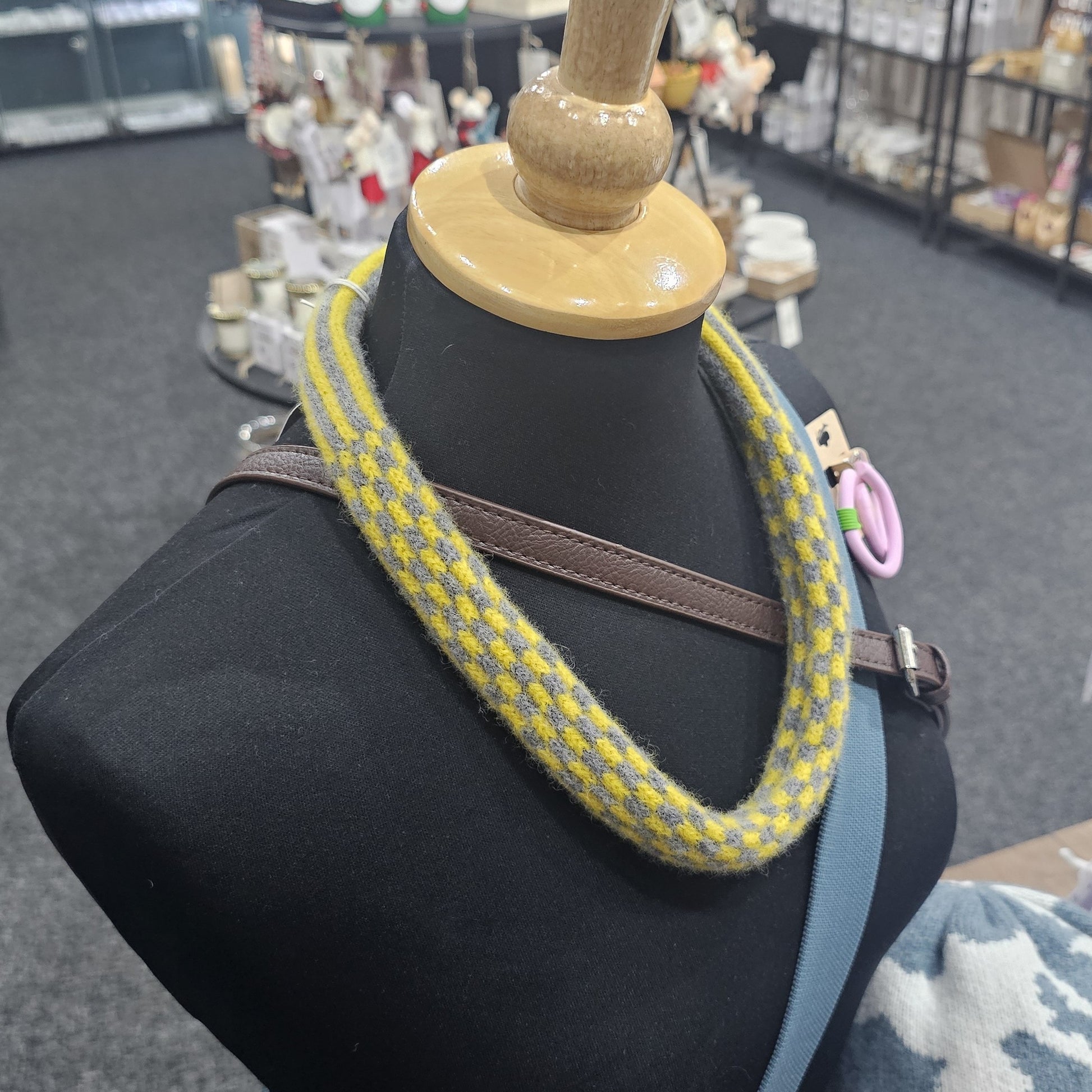 Handmade Scottish lambswool knitted necklace in soft looped design, shown on mannequin highlighting texture and craftsmanship.