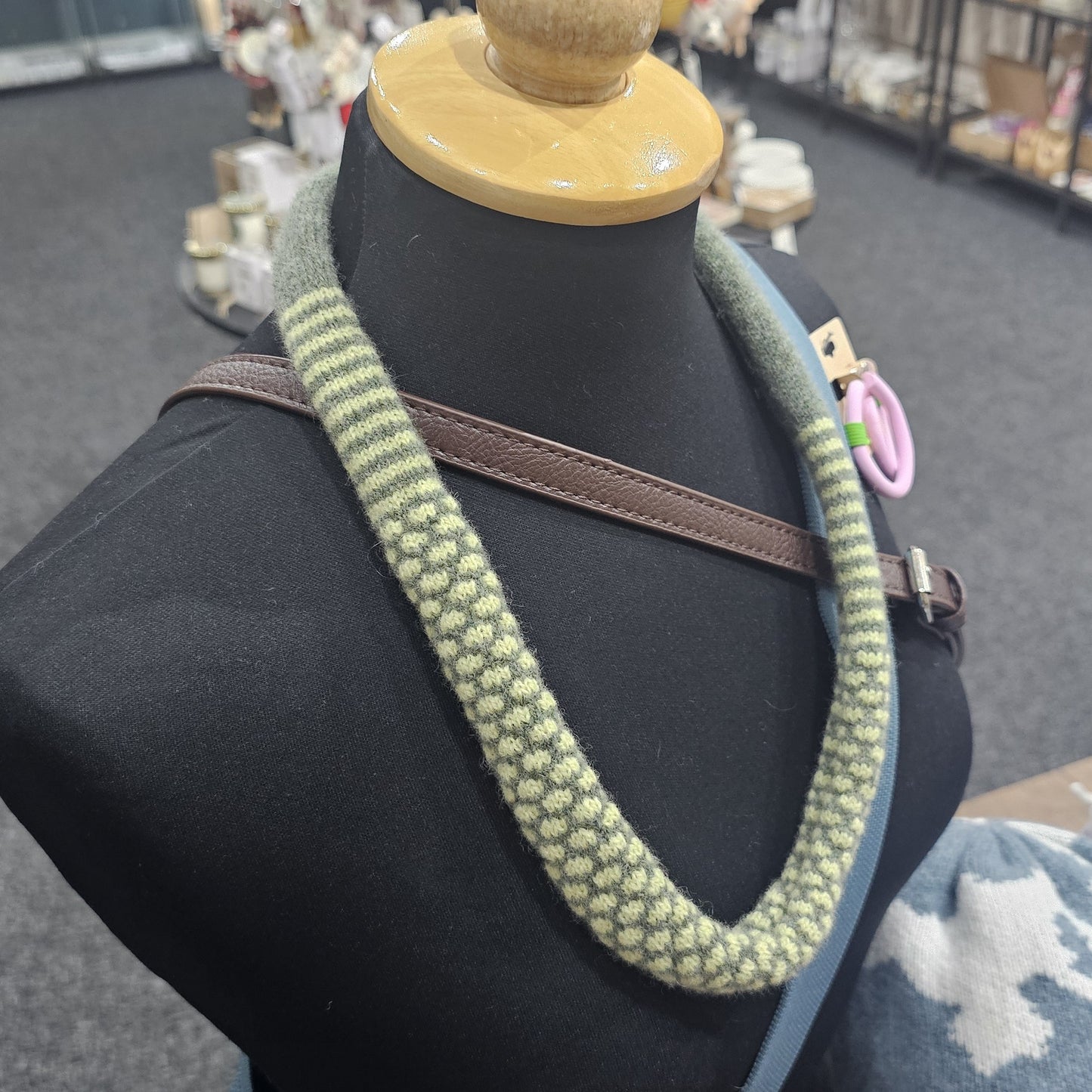 Handmade Scottish lambswool knitted necklace in soft looped design, shown on mannequin highlighting texture and craftsmanship.