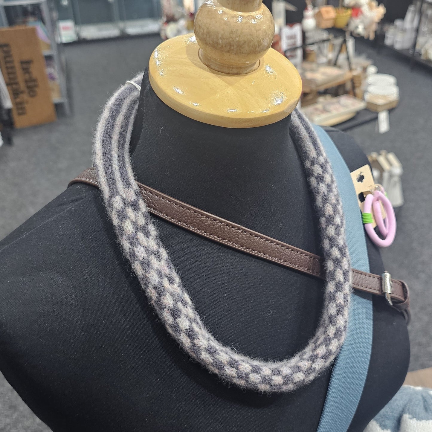 Handmade Scottish lambswool knitted necklace in soft looped design, shown on mannequin highlighting texture and craftsmanship.