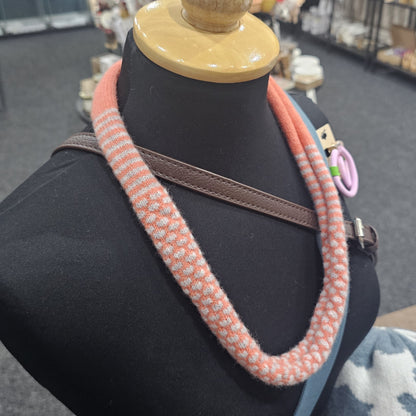 Handmade Scottish lambswool knitted necklace in soft looped design, shown on mannequin highlighting texture and craftsmanship.