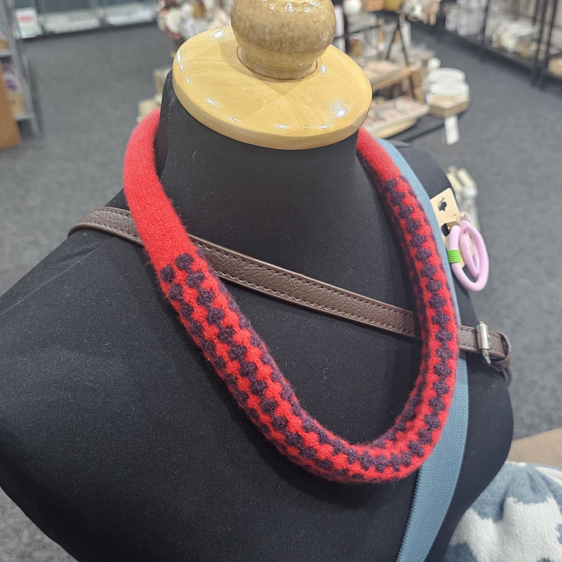 Handmade Scottish lambswool knitted necklace in soft looped design, shown on mannequin highlighting texture and craftsmanship.