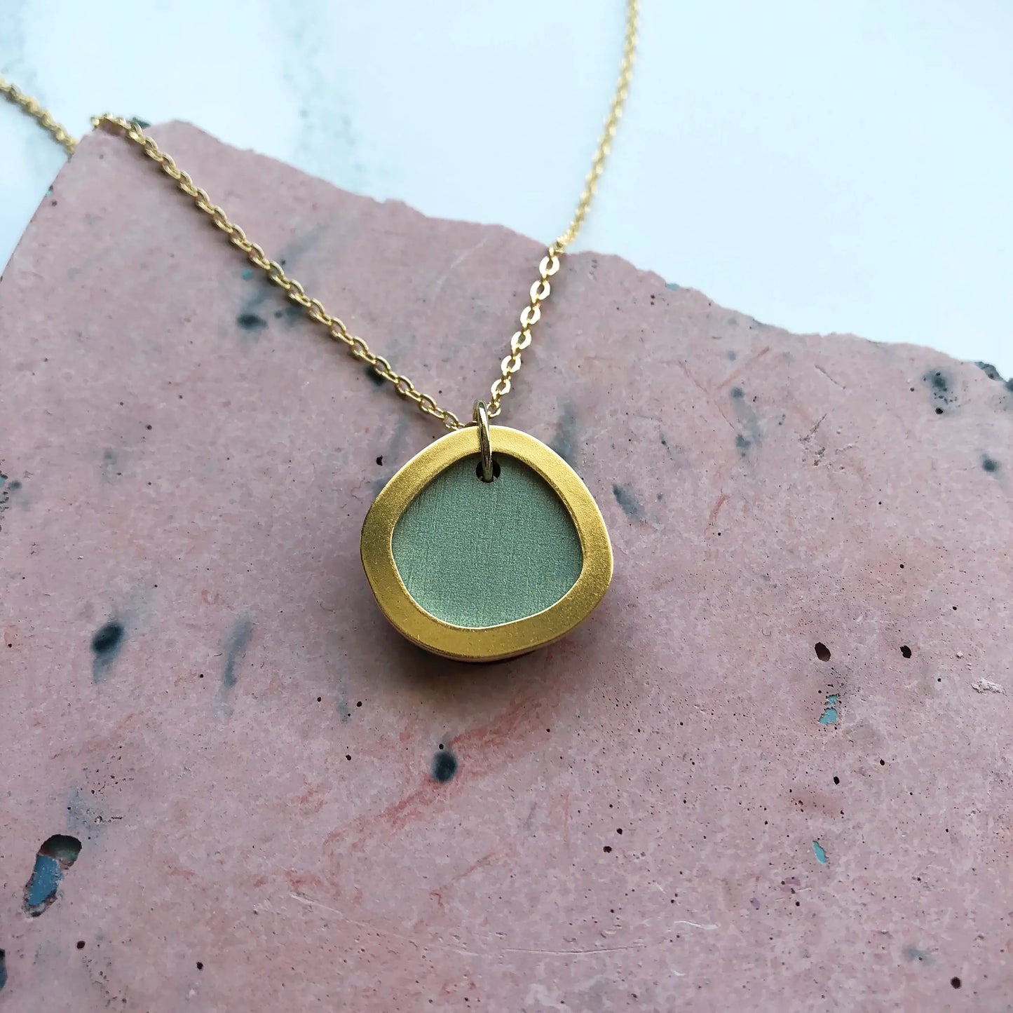 Gold-plated necklace with 1.5cm circular pendant in assorted colours on 22" chain