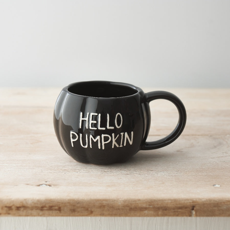 Black Pumpkin-shaped ceramic mug with white embossed Hello Pumpkin slogan.