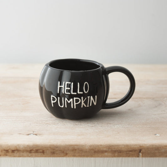 Black Pumpkin-shaped ceramic mug with white embossed Hello Pumpkin slogan.