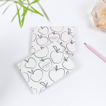 Recycled sticky notes pad in green or pink with Orchard Notes debossed cover and three sizes of biodegradable sticky notes