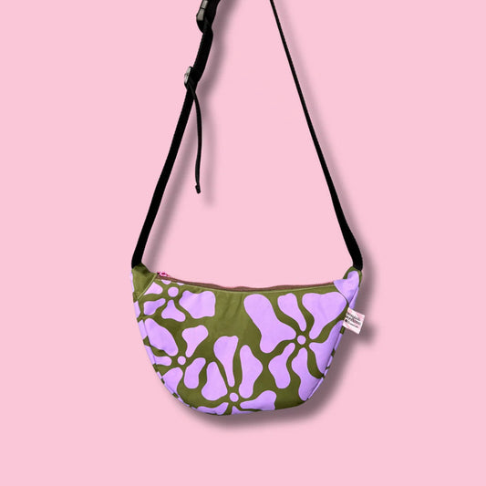 Handprinted sling bag handmade in Dundee from water-resistant wax cotton with padded lining, inner pocket and adjustable strap.