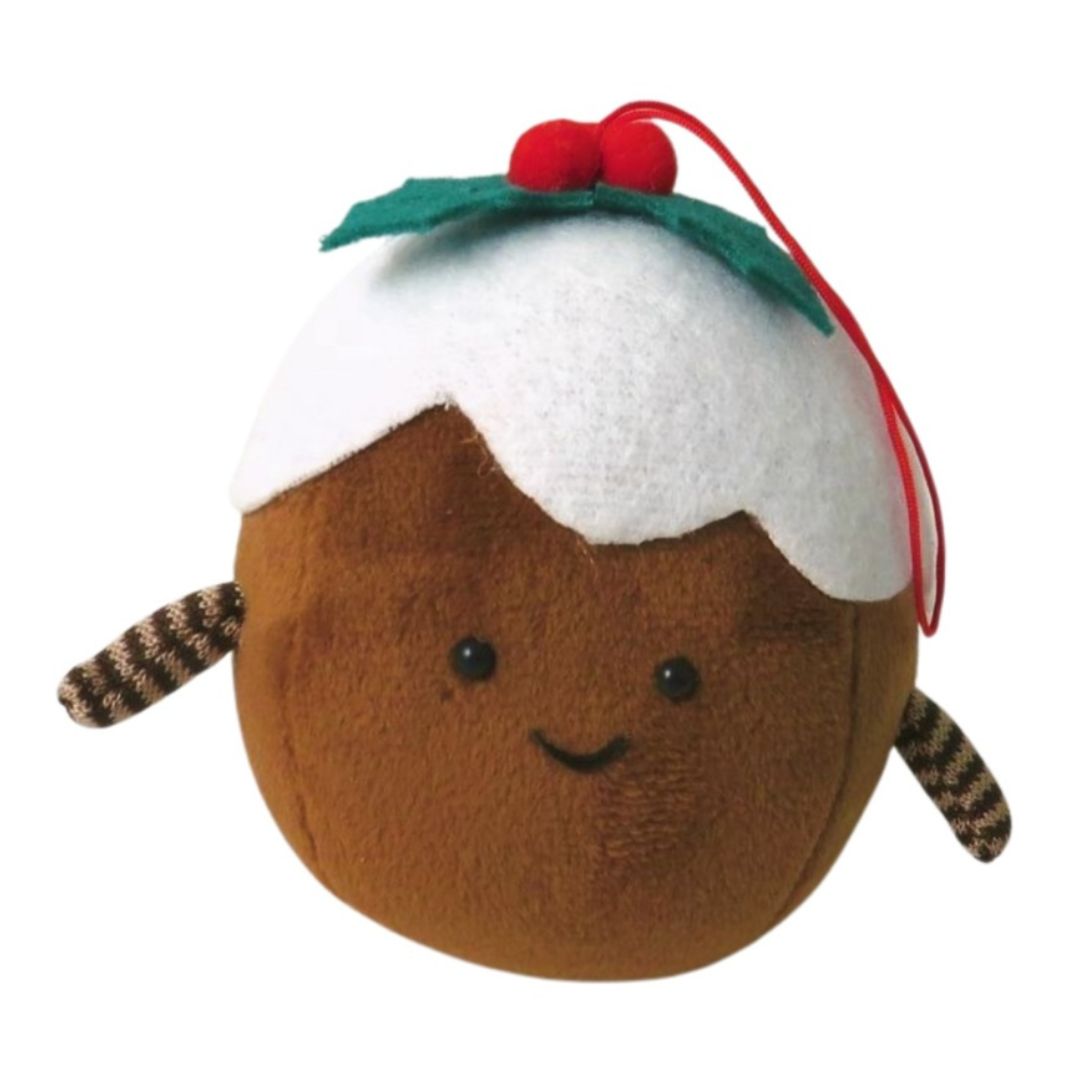 A cute fabric Christmas pudding hanging decoration with a cheerful face, brown base, white fabric topping, and small red berries.