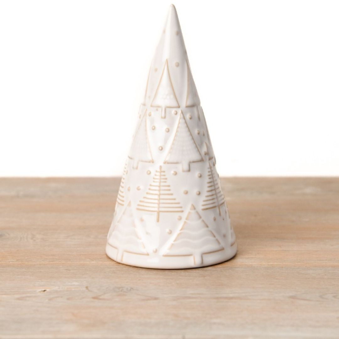 A decorative ceramic Christmas tree ornament with a simplistic shape, covered in a glossy reactive glaze and featuring embossed patterns of smaller trees and polka dots.