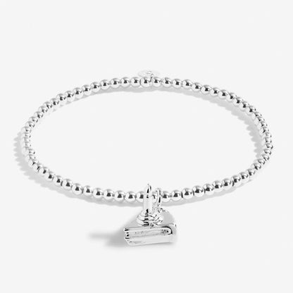 Silver-plated stretch beaded bracelet with cake shaped charm