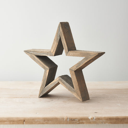 Rustic wooden star standing decoration, approximately 25cm high, suitable for display on a shelf or table.