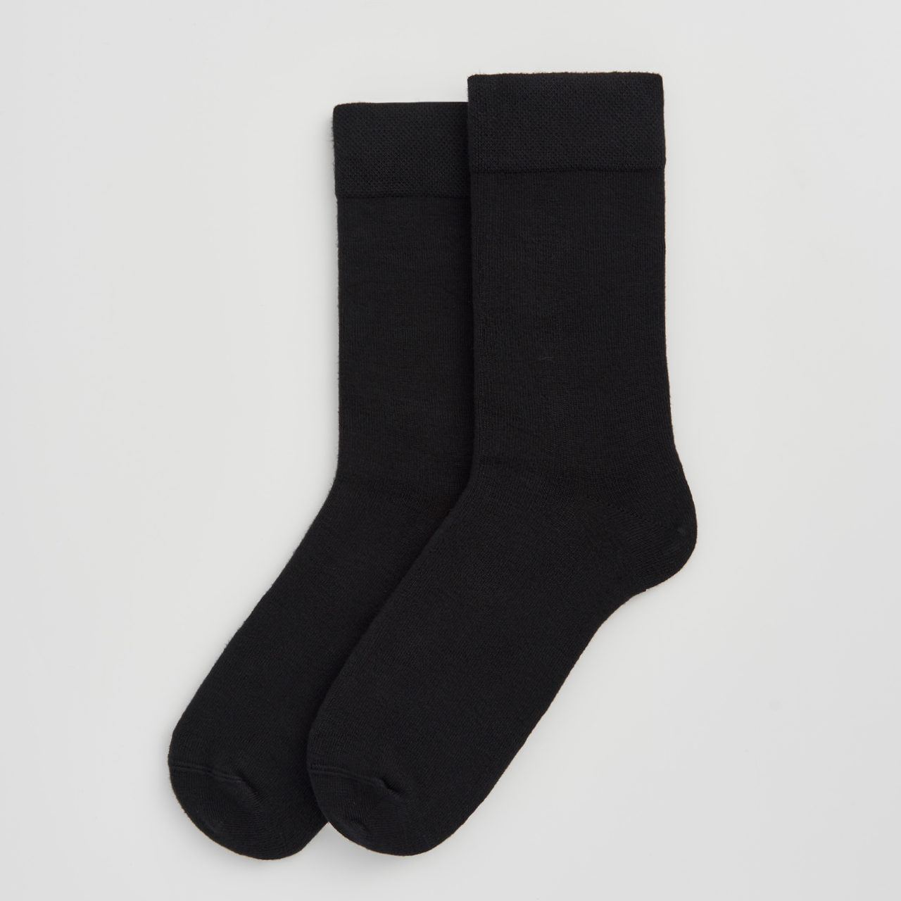 PAIRS Scotland Bamboo socks in True Black highlighting their soft texture.