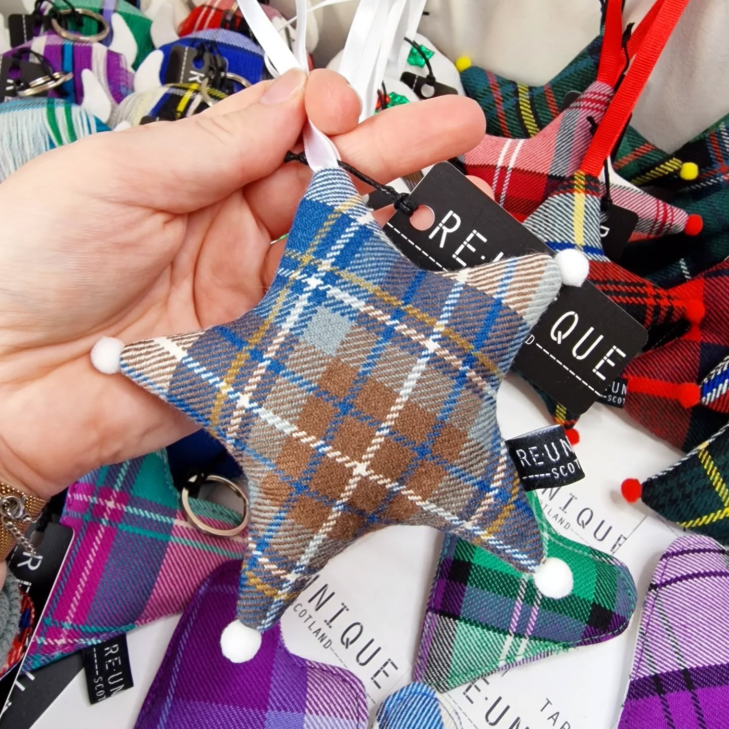 Unique Christmas tree decoration shaped like a festive Christmas star, made from genuine wool tartan fabric.